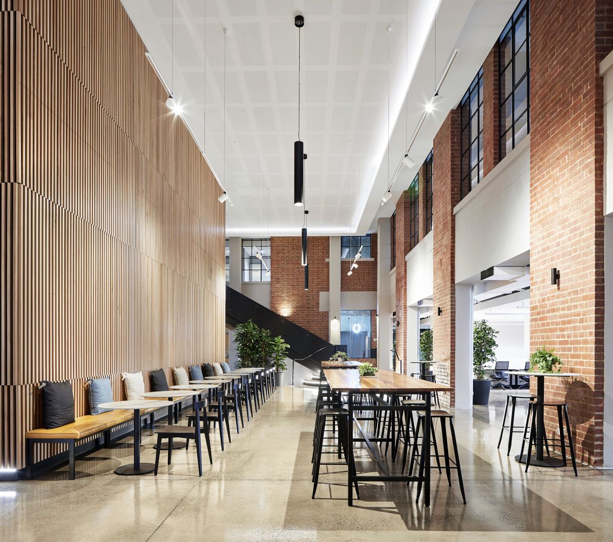 Coworking operator United Co’s premises by PTID is an adaptive reuse of an old warehouse. Photo: Tatjana Plitt